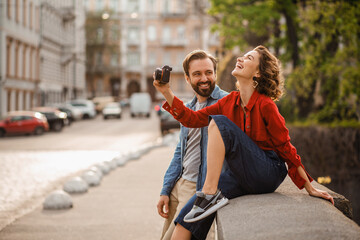 man and woman on romantic vacation walking together