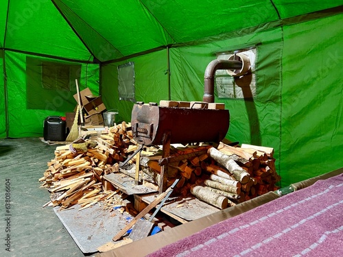 Canvas Print Places to warm up Rest point and steadfastness Firewood stands near the stove a