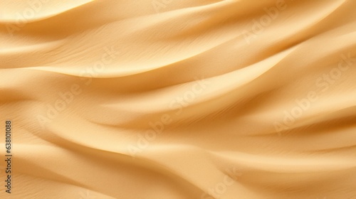 background with dune patterns.Rippled golden beige sand, in soft daylight