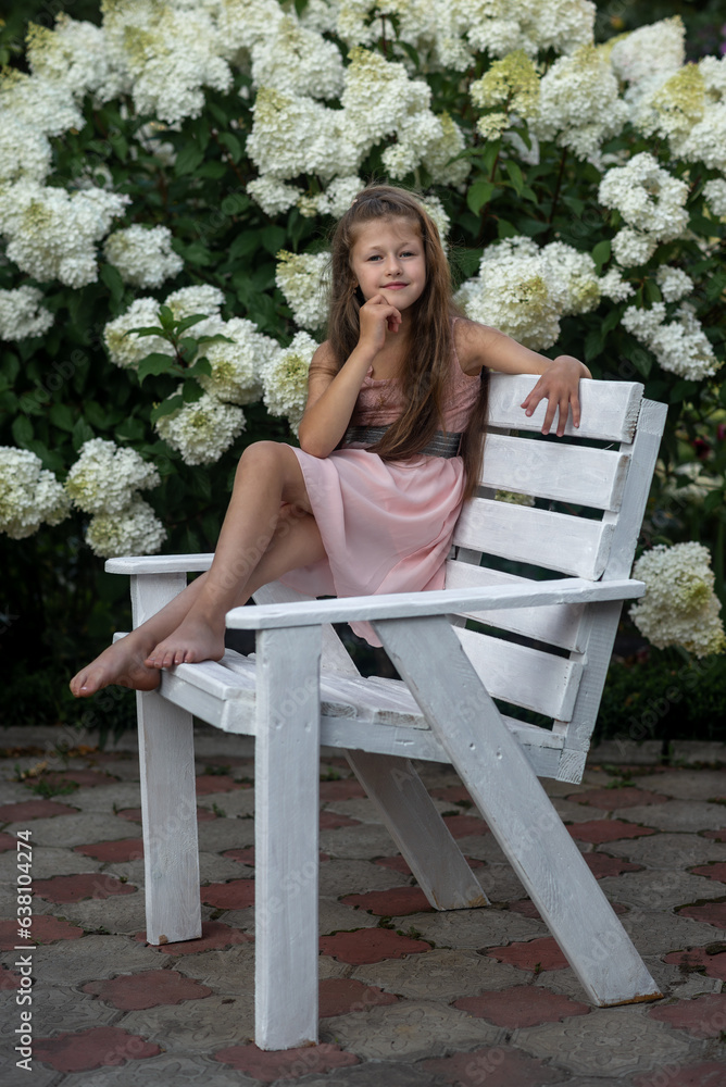 girl is sitting on a white bench girl is sitting on a white bench