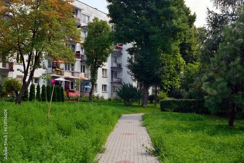 Walkway leading through green areas to blocks of flats built in the 70s