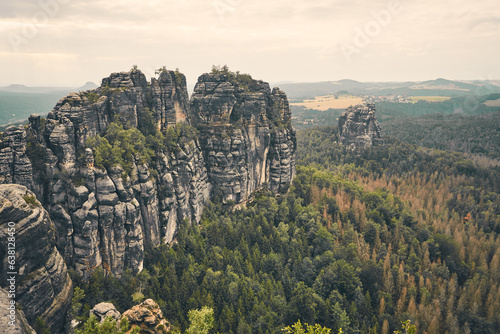 Ausblick auf die Schrammsteine in der Sächsischen Schweiz mit dem Falkenstein im Hintergrund photo