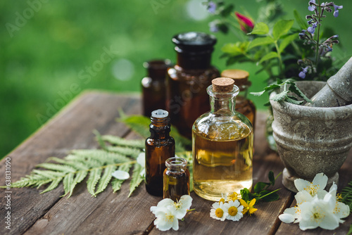 Apothecary concept, herbs and floral natural organic essential oils for wellbeing. Alternative medicine. Aromatherapy, pharmaceutical, preparation of homemade plant based cosmetic products.