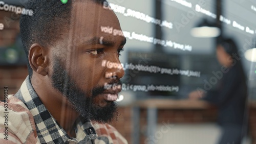 Developer helped by augmented reality to visualize script, writing code on computer screen while in workspace using Java programming languages. African american licensed professional mending errors