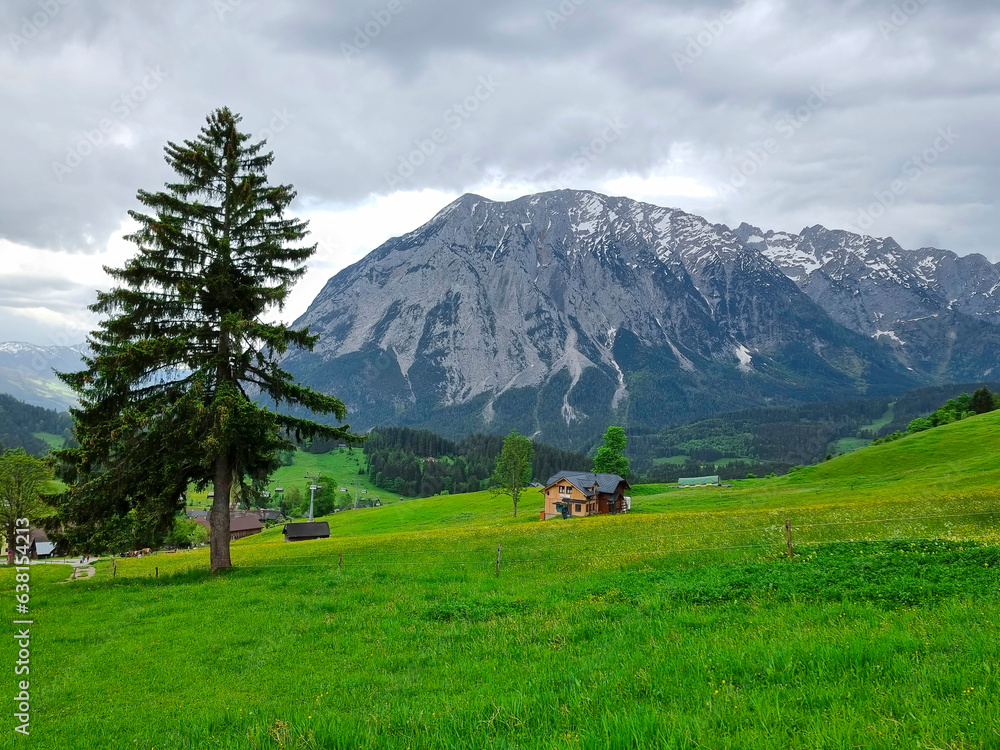 Summer austrian landscape with Grimming mountain (2.351 m), an isolated peak in the Dachstein Mountains, view from small alpine village Tauplitz, Styria, Austria