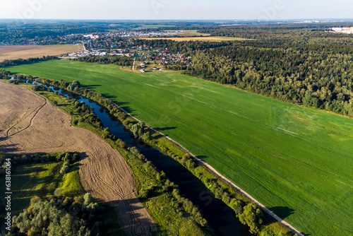 Flight over countryside with green fields and river