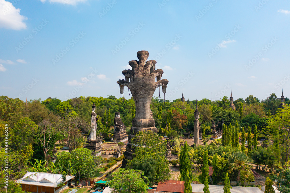 Aerial top view of Sala Keoku Sculptures Park, Isan pagoda is a buddhist temple, Nong Khai, an urban city town, Thailand. Thai architecture landscape background. Tourist attraction landmark.