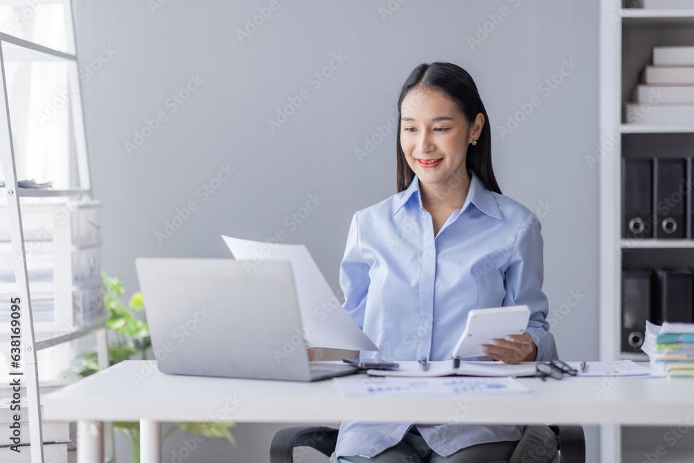 Portrait of Businesswoman Accounting using calculating documents income-expenditure and analyzing real estate investment data report Financial and tax systems concept. Portrait of Businesswoman Accounting using calculating documents income-expenditure and analyzing real estate investment data report Financial and tax systems concept.