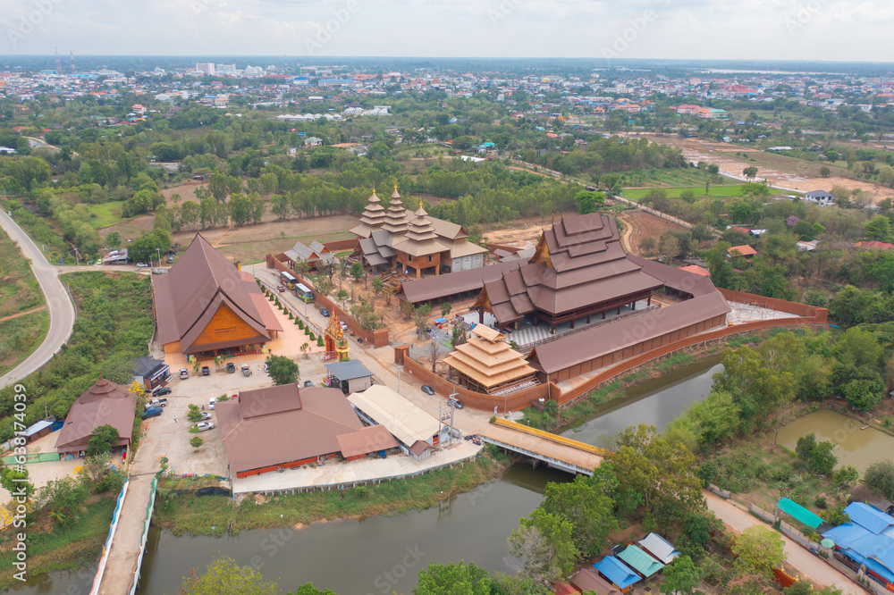 Aerial top view of The Isan pagoda is a buddhist temple near Bangkok, an urban city town, Thailand. Thai architecture landscape background. Tourist attraction landmark.