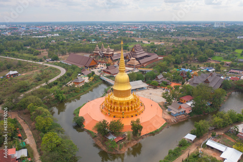 Aerial top view of The Isan pagoda is a buddhist temple near Bangkok  an urban city town  Thailand. Thai architecture landscape background. Tourist attraction landmark.