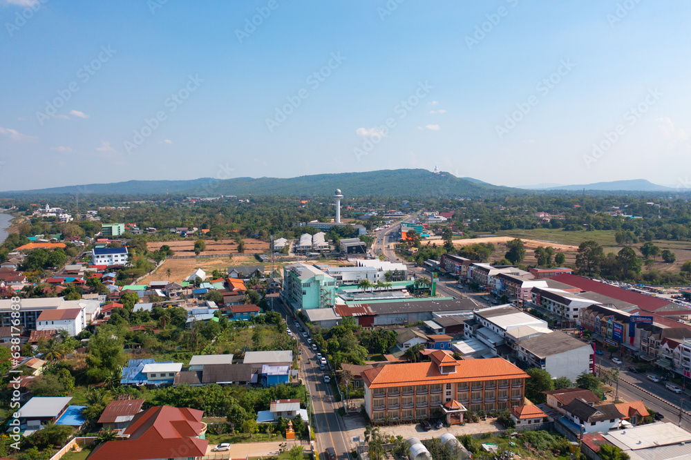 Aerial view of residential neighborhood roofs. Urban housing development from above. Top view. Real estate in Mukdahan, Isan province city, Thailand. Property real estate.