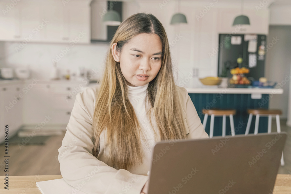 Young adult Asian woman working from home, distance learning, online teaching, video conference concept Young adult Asian woman working from home, distance learning, online teaching, video conference concept