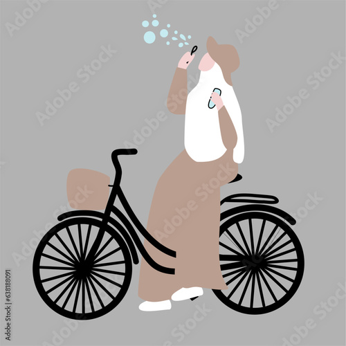 Muslim woman riding bicycle photo