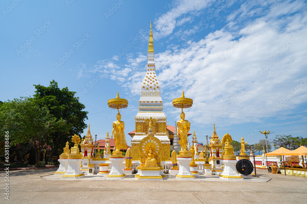 Fototapeta premium Wat Phrathat Phanom, Nakhon Phanom, Isan Temple. The pagoda is a buddhist temple in urban city town, Thailand. Thai architecture landscape background. Tourist attraction landmark.