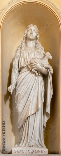 NAPLES, ITALY - APRIL 22, 2023: The marble statue of St. Agnes in the church Basilica dell Incoronata Madre del Buon Consiglio from 20. cent. 
