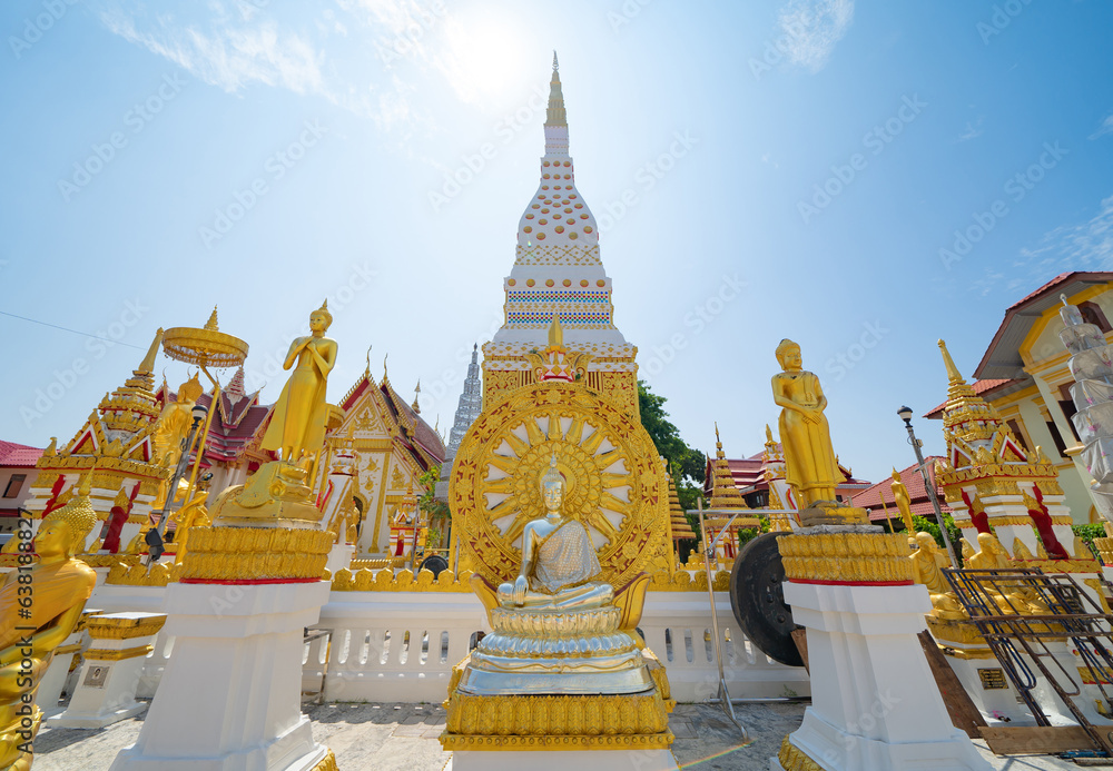 Fototapeta premium Wat Phrathat Phanom, Nakhon Phanom, Isan Temple. The pagoda is a buddhist temple in urban city town, Thailand. Thai architecture landscape background. Tourist attraction landmark.
