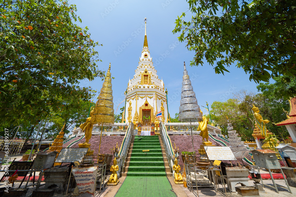 Naklejka premium Wat Phrathat Phanom, Nakhon Phanom, Isan Temple. The pagoda is a buddhist temple in urban city town, Thailand. Thai architecture landscape background. Tourist attraction landmark.