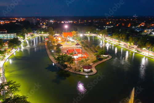 Aerial view of residential neighborhood roofs. Urban housing development from above. Top view. Real estate in Kalasin, Isan province city, Thailand. Property real estate at night. photo