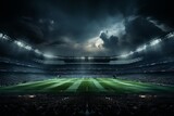 The vast football field emerges from darkness, bathed in the powerful glow of stadium lights, showcasing the arena's grandeur and anticipation.
