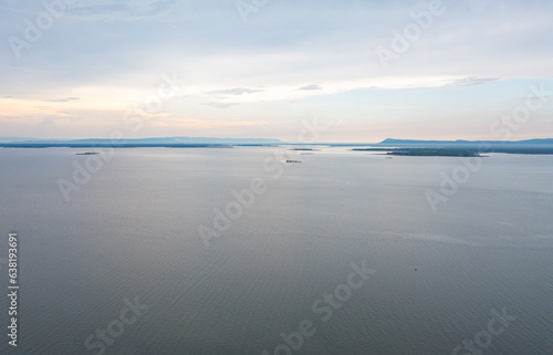 Aerial view of dam tower crane. Reservoir and sea water in recycle energy industry concept for electricity in Natural landscape background in Thailand. Environment. © tampatra