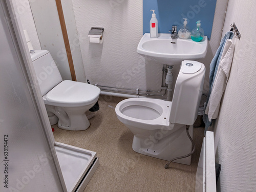 two toilets inside a restroom