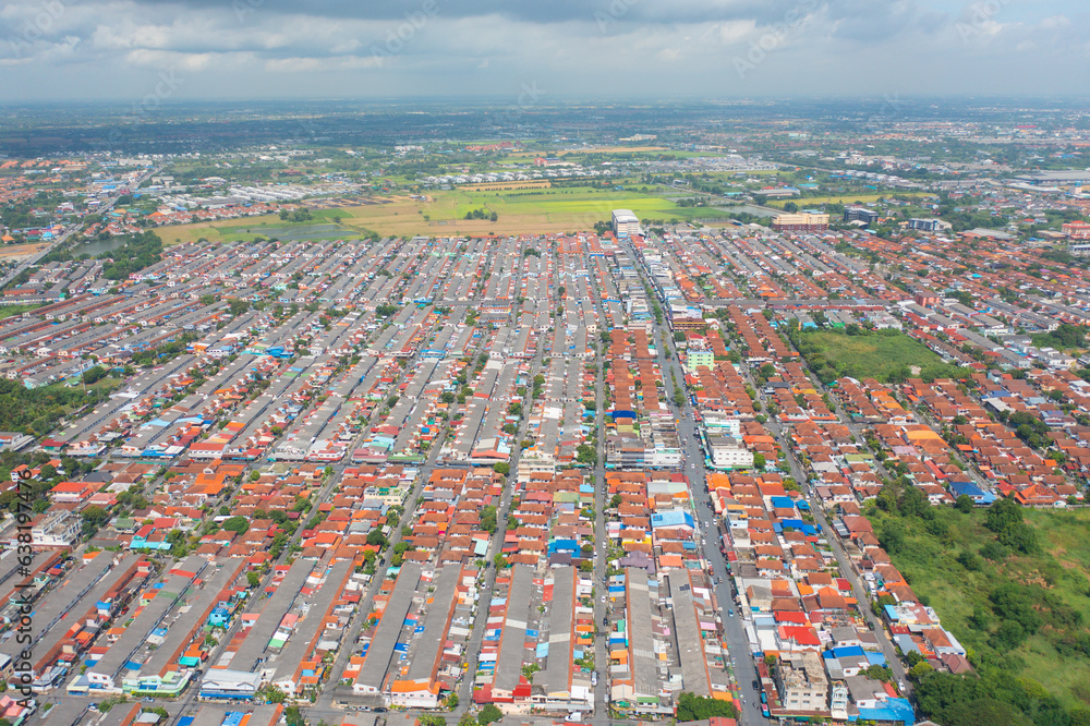 Aerial view of residential neighborhood roofs. Urban housing development from above. Top view. Real estate in Bangkok province city, Thailand. Property real estate.