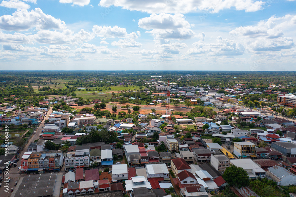 Aerial view of local residential neighborhood roofs. Urban housing development from above. Top view. Real estate in Isan urban city town, Thailand. Property real estate.