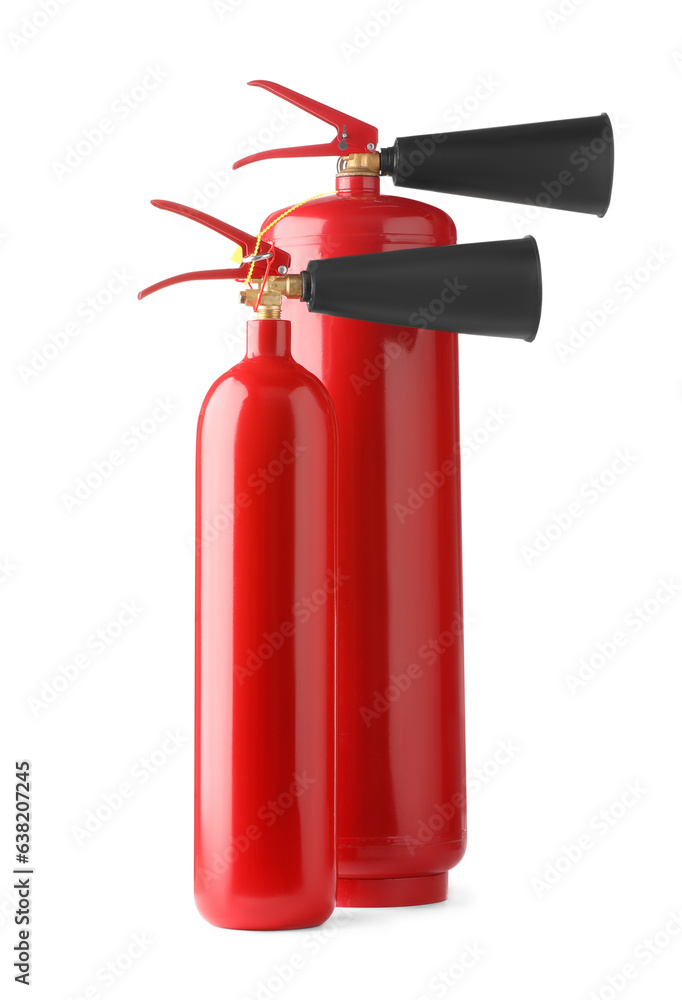 Two red fire extinguishers on white background Two red fire extinguishers on white background