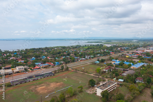 Aerial view of local residential neighborhood roofs. Urban housing development from above. Top view. Real estate in Isan urban city town, Thailand. Property real estate.