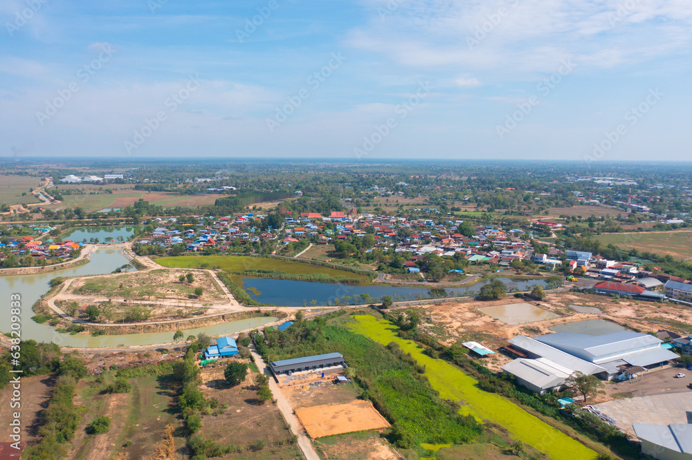 Aerial view of local residential neighborhood roofs. Urban housing development from above. Top view. Real estate in Isan urban city town, Thailand. Property real estate.