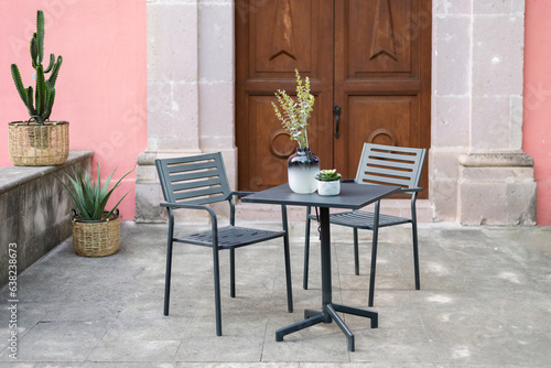 Outdoor cafe metal garden chairs, Greece. Selective focus. outdoor restaurant