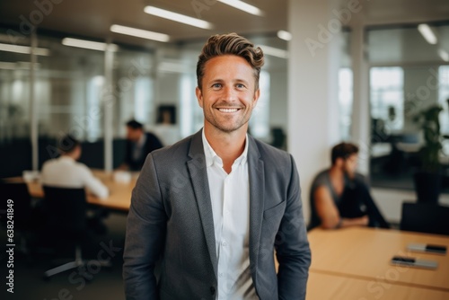 Portrait of a smiling young caucasian man working in a startup company office