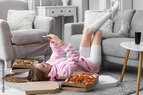 Young woman with tasty pizz...