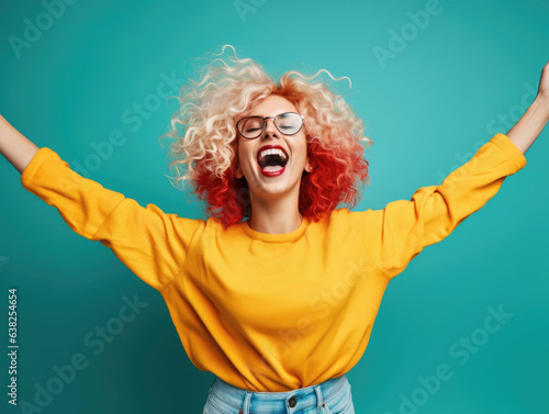 Cheerful woman is dancing with her hands up