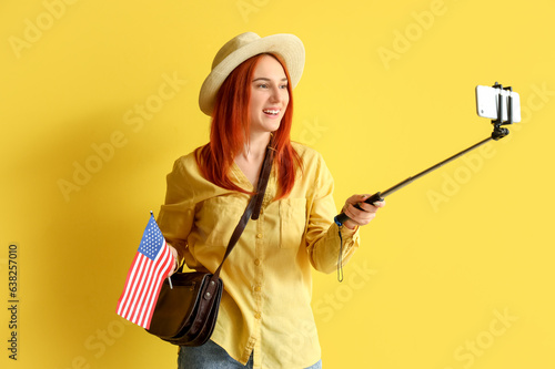 Young redhead woman with US...