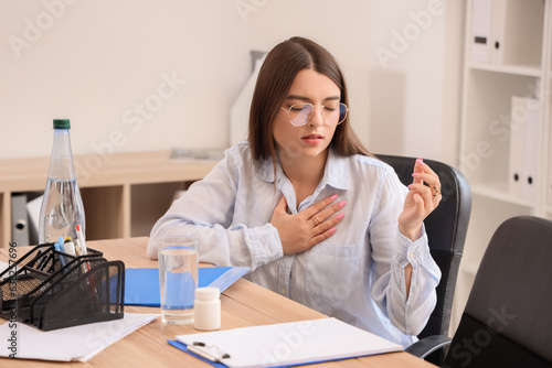 Young businesswoman with he...