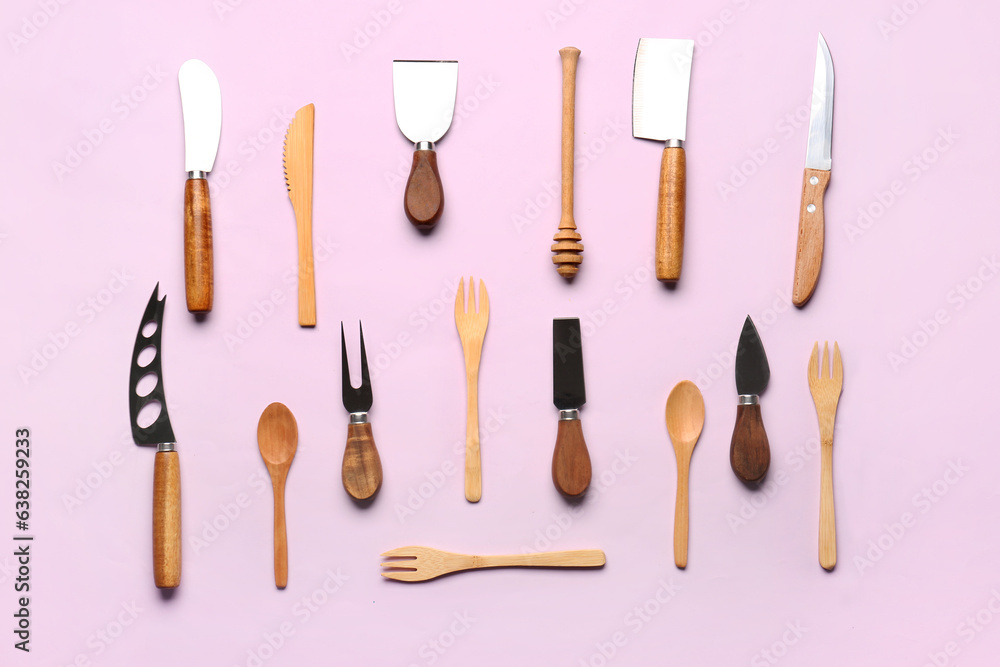 Wooden kitchen utensils on lilac background Wooden kitchen utensils on lilac background