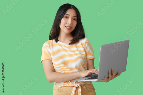 Young asian woman with brac...