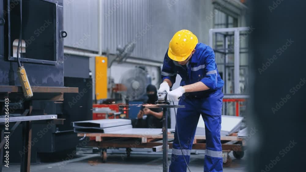Asian worker man using grinding machine and cutting steel have spark from the grinding wheel at metal production factory industrial Asian worker man using grinding machine and cutting steel have spark from the grinding wheel at metal production factory industrial