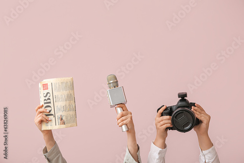 Female hands with newspaper...