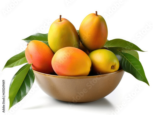 Bowl with mangoes and green leaves on a white background