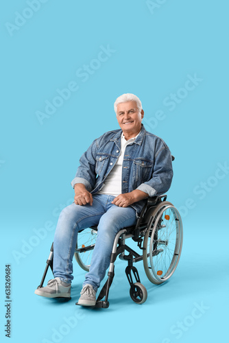 Mature man in wheelchair on...