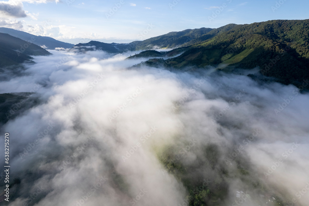 Top view Landscape of Morning Mist with Mountain Layer at north of Thailand. mountain ridge and clouds in rural jungle bush forest