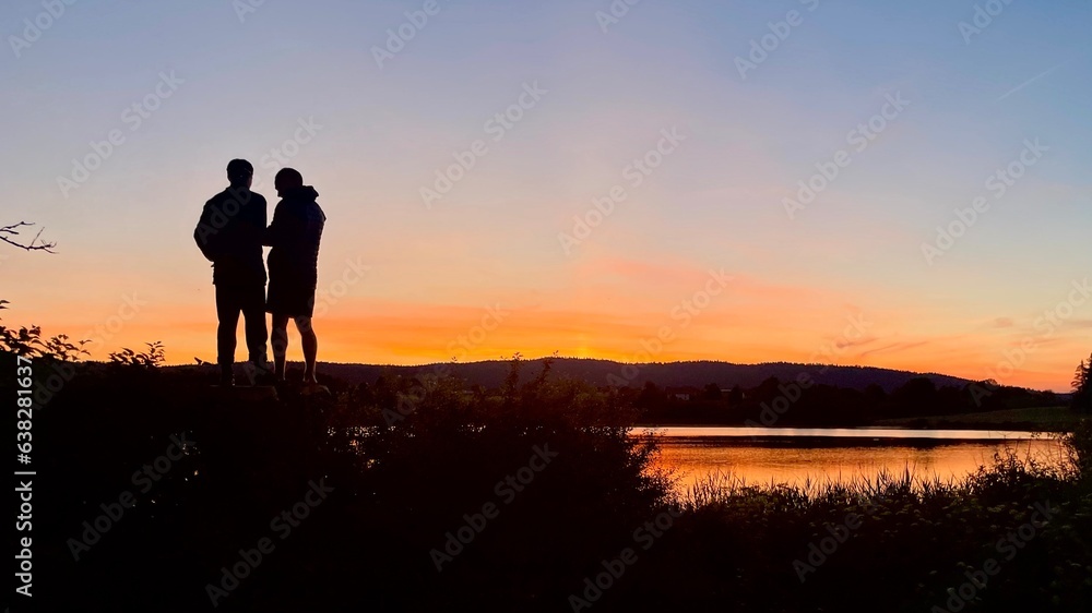 two friends during a sunset, Lac de l’Abbaye, Jura, France.