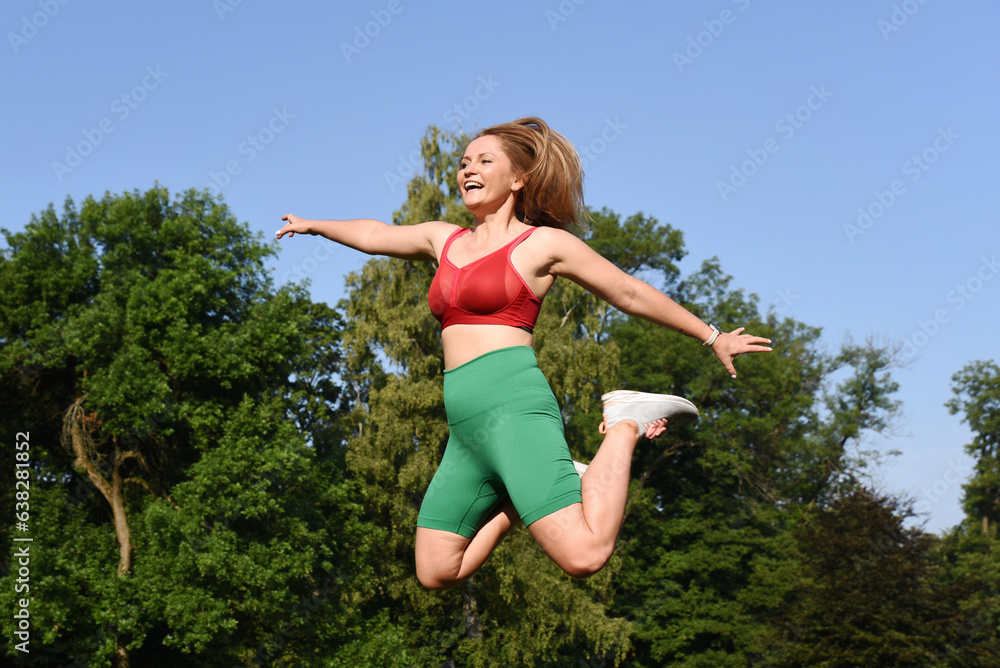 Sportswoman jump and fly during training and practice exercise. Energy, activity and strenght in sporty body. Happy woman in healthy lifestyle outdoor. Sportswoman jump and fly during training and practice exercise. Energy, activity and strenght in sporty body. Happy woman in healthy lifestyle outdoor.