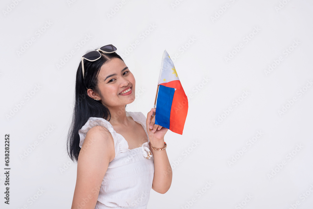 Portrait of a proud FIlipina woman waving the Philippines national flag. Patriotic young lady proud of her roots. Isolated on a white background. Portrait of a proud FIlipina woman waving the Philippines national flag. Patriotic young lady proud of her roots. Isolated on a white background.