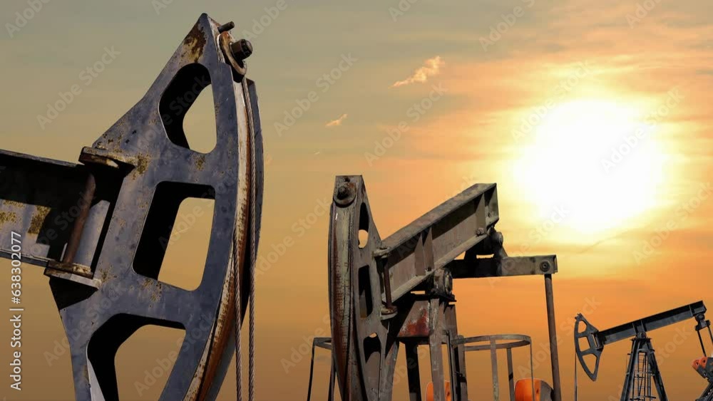 Three Oil Well Pump Jacks Pumping Crude Oil from Underground Reservoirs