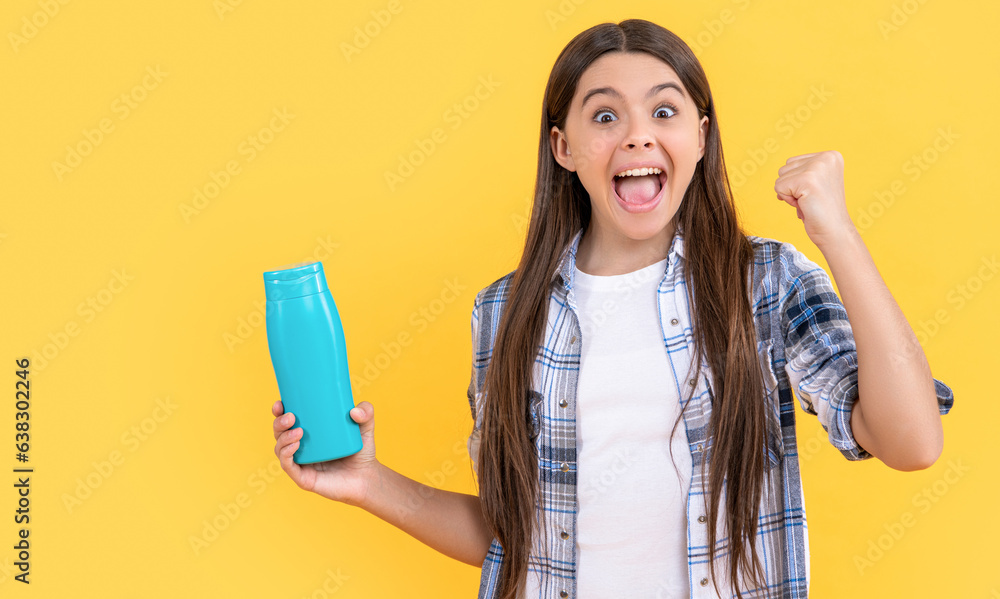 surprised teen girl with shampoo cosmetics in studio. teen girl with shampoo cosmetics surprised teen girl with shampoo cosmetics in studio. teen girl with shampoo cosmetics