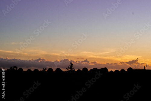 silhouette of cyclist sunset