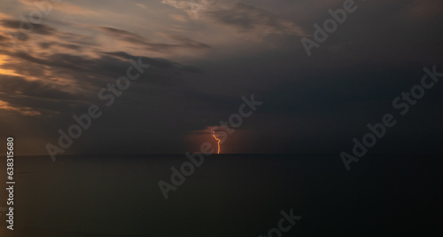 Lightning over the sea during a thunderstorm on a summer night